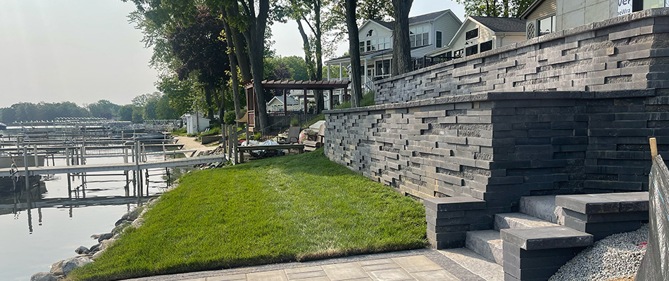 Custom retaining wall and landscape bed with mulch in Granger, IN.