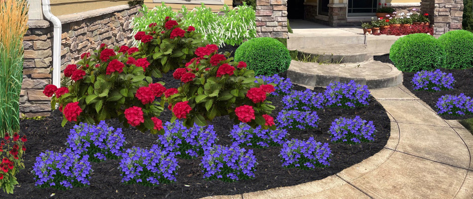 Rock mulch landscape bed with new plantings in Granger, IN.