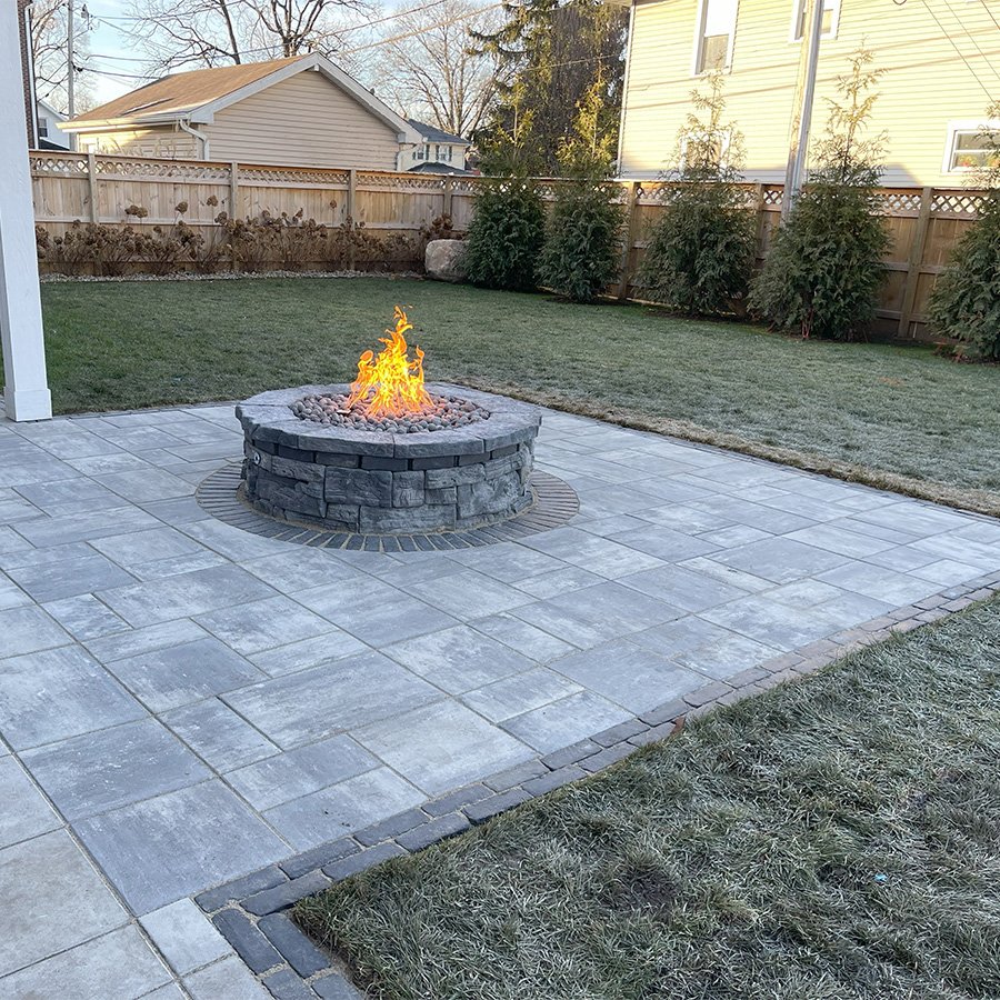 Custom-designed firepit set in a modern outdoor living space